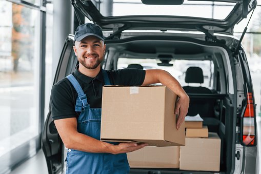 Courier handling parcels for delivery